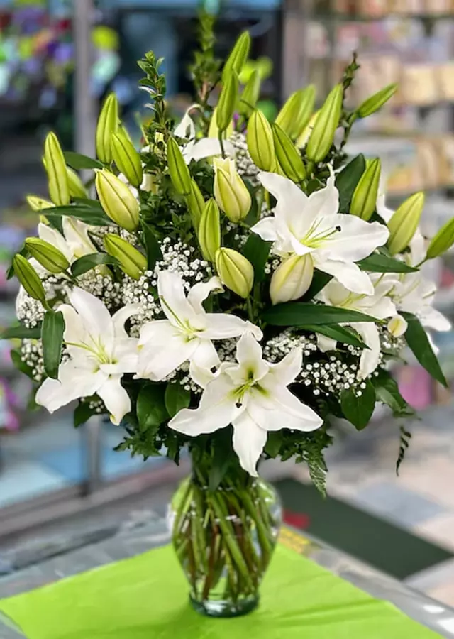 Display of Classic White Lilies Vase Arrangement by The Flower Alley