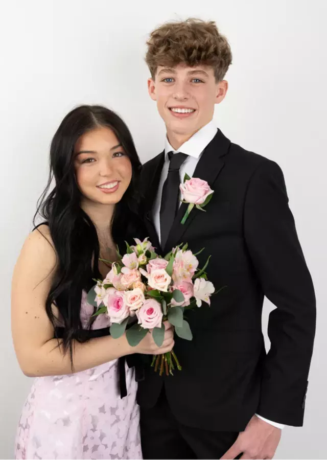 Display of Matching Prom Set: Light Pink Bouquet and Boutonnière by The Flower Alley